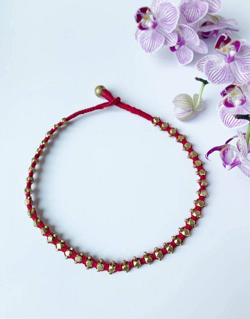 Threads of Tradition: Red and Gold Bracelet